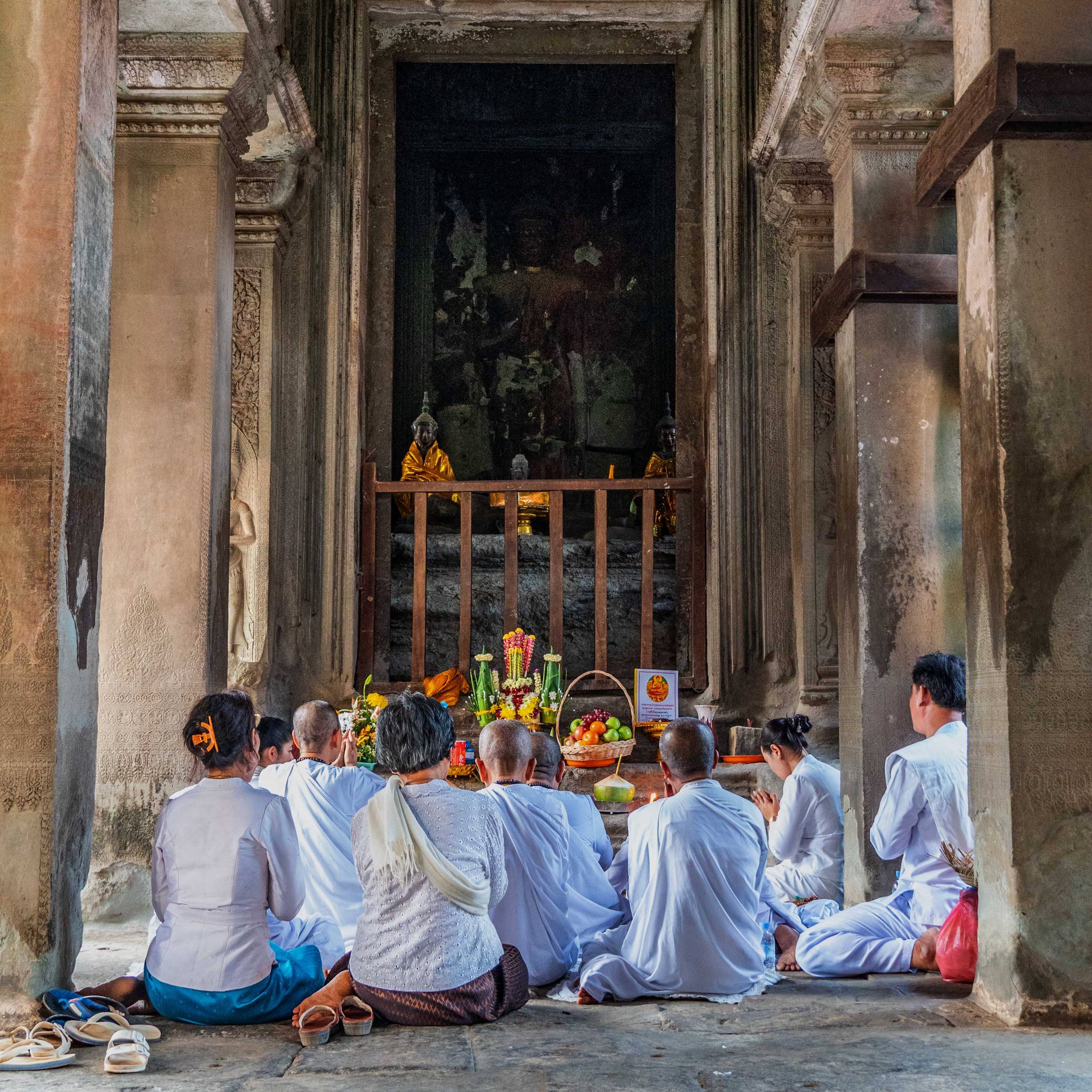 PRAYING NUNS AT ANGKOR WAT