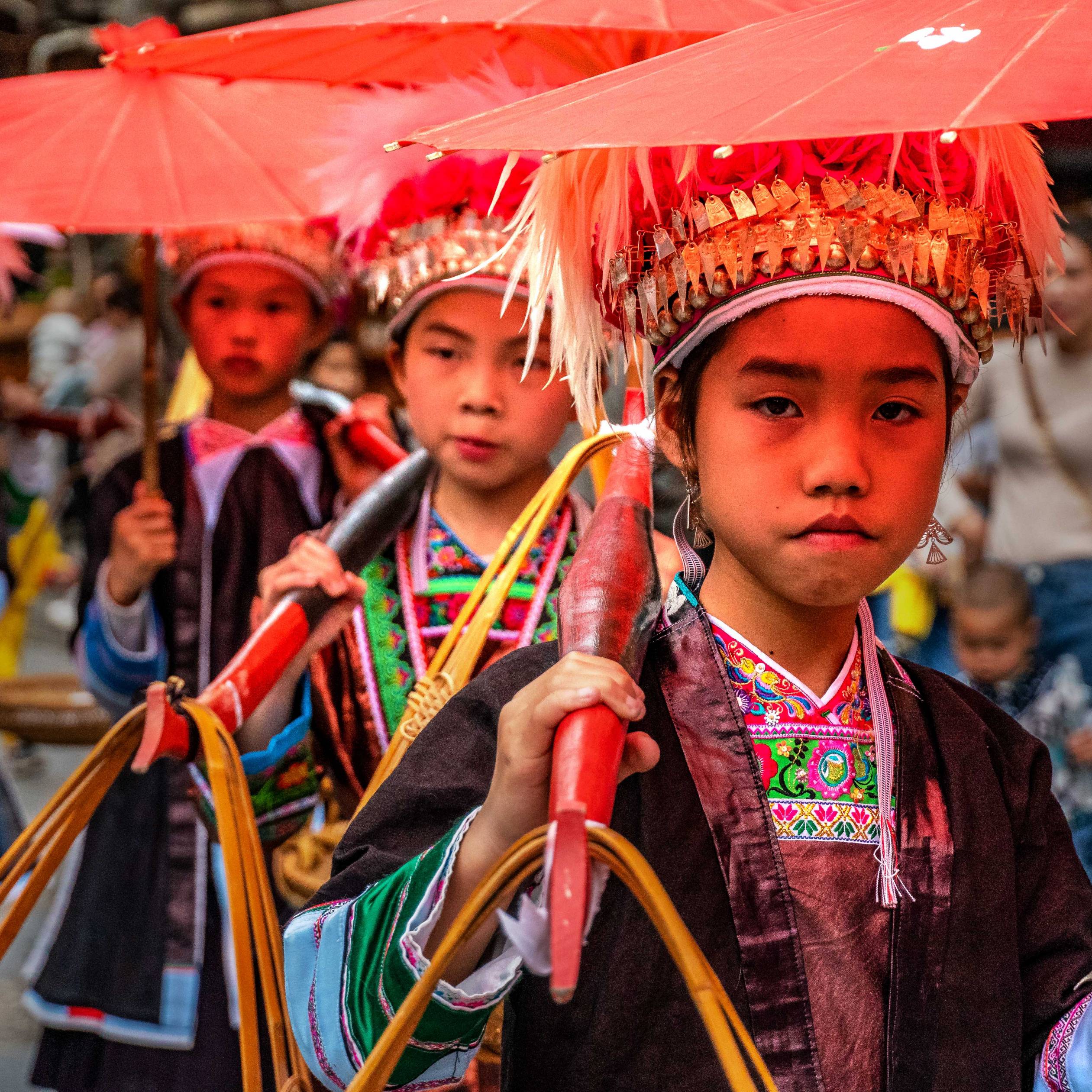 Children presenting traditional clothes of the Miao ethnic group, Hua Zhuang Miao Village, Province Yunnan