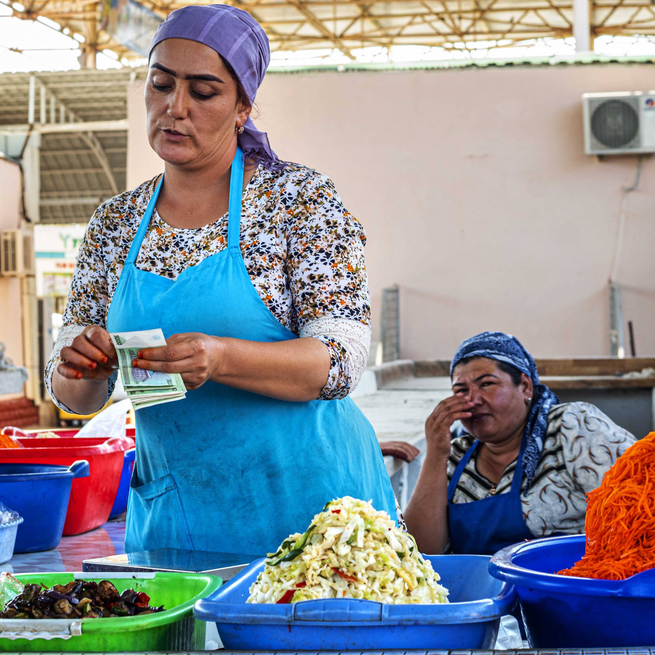 A woman selling pickled salads at Markaziy Bazar